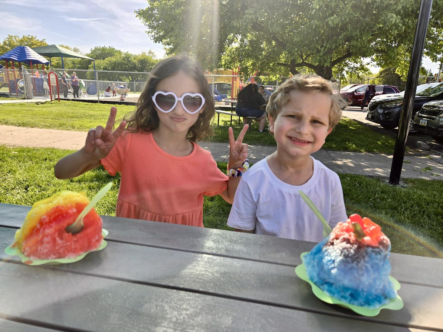 Two happy kids enjoying shaved ice